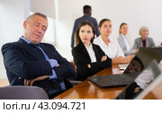 Mature white businessman sleeping during meeting. Стоковое фото, фотограф Яков Филимонов / Фотобанк Лори