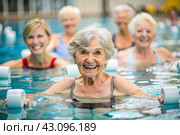 An elderly woman swims and does water aerobics in a heated pool, a happy and smiling retired woman. Recreational water sports. Стоковое AI-изображение, AI-художник Photojuli / Фотобанк Лори