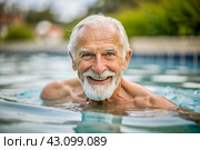 An elderly man swims and does water aerobics in a heated pool, a happy and smiling pensioner. Recreational water sports. Стоковое AI-изображение, AI-художник Photojuli / Фотобанк Лори