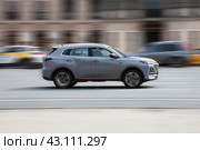 Changan CS55 Plus car driving on city road with motion blur, view from the side. Редакционное фото, фотограф Константин Григорьев / Фотобанк Лори