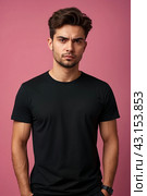 Dissatisfied young man looking unpleasantly away, expresses aversion, smirking at pink background. Guy in black t-shirt scared, negative face expressions concept. Advertising. Copy text space. Стоковое AI-изображение, AI-художник Aleksandr Golubev / Фотобанк Лори