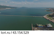 Top view of the marina and quay of Novorossiysk. Urban landscape of the port city. Стоковое видео, видеограф Леонид Еремейчук / Фотобанк Лори