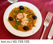 Grilled vegetables Tunisian mechouia salad with tuna and olives on top, closeup. Стоковое фото, фотограф Яков Филимонов / Фотобанк Лори