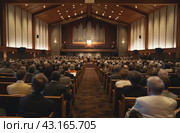 Audience at modern church event. Стоковое AI-изображение, AI-художник Данил Руденко / Фотобанк Лори