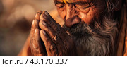 An elderly man with gray hair prays in the sunset with folded arms and closed eyes. Close-up. Стоковое AI-изображение, AI-художник Ярославский Максим / Фотобанк Лори