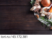 Beef bone and vegetable ingredients for cooking broth. Healthy food with collagen and amino acids. Copy space. Стоковое фото, фотограф Глущенко Елена / Фотобанк Лори