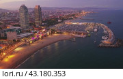 Drone view of the evening Barcelona, the capital of Catalonia, on the Mediterranean coast, Spain. Стоковое видео, видеограф Яков Филимонов / Фотобанк Лори