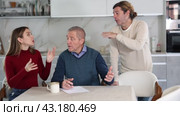 Couple discussing inheritance with older man. Стоковое видео, видеограф Яков Филимонов / Фотобанк Лори
