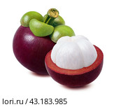 Whole mangosteen and piece cut in half isolated on white background. Стоковое фото, фотограф Катерина Ковалева / Фотобанк Лори