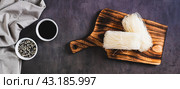 Two servings of funchose dry rice noodles on a board on the table top view web banner. Стоковое фото, фотограф Елена Руй / Фотобанк Лори