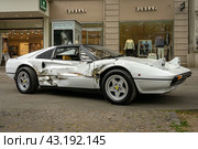 BERLIN - MAY 04, 2024: The sports car Ferrari 308 GTS with a broken body after a car accident. Classic Days Berlin 2024. Редакционное фото, фотограф Sergey Kohl / Фотобанк Лори