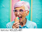 Portrait of an extraordinary, stylish, fashionable elderly woman, a pensioner of 70 years old, with glasses and ice cream in her hand. The concept of happy seniors and delicious desserts. Стоковое AI-изображение, AI-художник Photojuli / Фотобанк Лори
