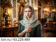 Portrait of a beautiful young woman in a headscarf in an Orthodox church. A girl prays in a church against the background of icons. Стоковое AI-изображение, AI-художник Photojuli / Фотобанк Лори