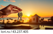 Realtor's hand with keys to house for beach holiday in hot tropics with palm trees. Hotel reservations, booking, moving to new house, mortgage, rent and purchase of real estate. AI generated. Стоковое AI-изображение, AI-художник Ольга Симонова / Фотобанк Лори