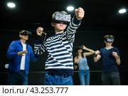 Boy child playfully poses in virtual reality glasses. Стоковое фото, фотограф Яков Филимонов / Фотобанк Лори