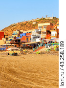 Panorama view of the red cliffs and Legzira village on the Atlantic Coast of Morocco (2024 год). Редакционное фото, фотограф Евгений Ткачёв / Фотобанк Лори