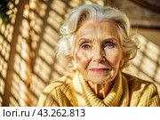 Minimalism. A studio portrait of a stylish, elegant elderly woman, a pensioner of 70 years old, in an interior and clothes of calm tones. The concept of the elderly. Стоковое AI-изображение, AI-художник Photojuli / Фотобанк Лори