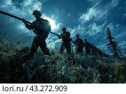Group of soldiers pulling a rope against the background of the morning or evening sky. The soldiers are dressed in military uniforms and helmets, silhouetted against the bright sunlight breaking through the clouds. The picture conveys an atmosphere of unity, strength and perseverance. The grass in the foreground is covered with dew, which adds special drama and realism to the scene. The trees and clouds in the background provide a picturesque backdrop, highlighting the harsh conditions the soldiers endure. Стоковое AI-изображение, AI-художник Анна Кривицкая / Фотобанк Лори