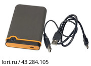 Внешний жесткий диск на белом фоне. External portable hard drive, isolated on a white background. Стоковое фото, фотограф Татьяна Д / Фотобанк Лори