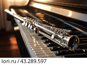 Close-up of flute on piano keys. Flute with piano. Wind instrument for musical design of concert creativity. Music orchestra concept. Copy ad text space. Стоковое AI-изображение, AI-художник Aleksandr Golubev / Фотобанк Лори