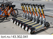 Moscow, Russia - May 9. 2024. Whoosh scooter sharing on the Garden Ring street. Редакционное фото, фотограф Володина Ольга / Фотобанк Лори