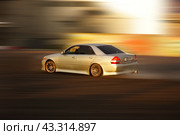 A high-speed drift car, in turn, is a supercar racing through the city at high speed. Стоковое фото, фотограф Ярославский Максим / Фотобанк Лори