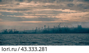 smoke after the explosion in the seaport war in Ukraine (2024 год). Стоковое фото, фотограф Артем Курутин / Фотобанк Лори