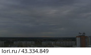 Дождевые облака над городом на фоне заката. Покадровая съемка (тайм-лапс) (2024 год). Стоковое видео, видеограф Константин Шалькевич / Фотобанк Лори