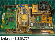 Vintage ABIT BH6 motherboard with Slot 1 processor and expansion modules for retro PC assembly. Virtual Museum of Electronics. (2024 год). Редакционное фото, фотограф Андрей Жигальцов / Фотобанк Лори