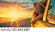 A happy girl in glasses and a straw hat leans out of the window of a yellow car against the sunset background. Copy space. Стоковое AI-изображение, AI-художник Ярославский Максим / Фотобанк Лори