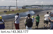 Panorama of the performances of athletes in drift cars in front of the audience at the ADM Racing track in Myachkovo. Russia. Moscow. 29.05.2024. Редакционное видео, видеограф Ярославский Максим / Фотобанк Лори