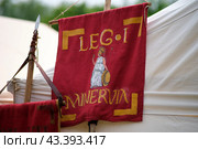 Flag of the 1st Roman Legion, historical reconstruction . The Times and Epochs Festival 2024 - Moscow, Russia, June 16, 2024. Редакционное фото, фотограф Андрей Журавлев / Фотобанк Лори