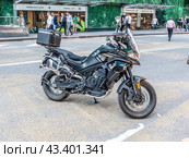CFMOTO 800MT Touring motorcycle parked on city street. Редакционное фото, фотограф Константин Григорьев / Фотобанк Лори