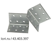 Металлический крепежный угольник на белом фоне. Metallic angle fixator on white background. Стоковое фото, фотограф Татьяна Д / Фотобанк Лори