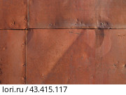 Old rusted metal texture. The surface of an uneven iron wall. Perfect for background and grunge design. Стоковое фото, фотограф Андрей Степанов / Фотобанк Лори