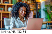 A woman sits at a table using a laptop, surrounded by shelves, a bookcase, and an event ringlet. Стоковое AI-изображение, AI-художник Юрий Поздников / Фотобанк Лори