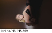 Blonde Woman Posing in Black Dress on a White Surface. Стоковое видео, видеограф Гурьянов Андрей / Фотобанк Лори