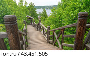 Russia, Ivanovo region, the city of Ples, May 20 2024, Levitan's Path with a Wooden Staircase in the Town of Ples: Climbing Levitan Mountain. Редакционное фото, фотограф Скрипачев Антон / Фотобанк Лори