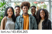 A group of happy young individuals standing close together, smiling, and posing for a photograph. Стоковое AI-изображение, AI-художник Юрий Поздников / Фотобанк Лори