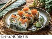Japanese food. Sushi rolls California, Philadelphia with eel, red caviar and salmon. The concept of the sushi bar menu. Стоковое AI-изображение, AI-художник Photojuli / Фотобанк Лори