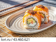 Japanese food. Sushi rolls California, Philadelphia with eel, red caviar and salmon. The concept of the sushi bar menu. Стоковое AI-изображение, AI-художник Photojuli / Фотобанк Лори