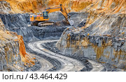 Yellow excavator in quarry with scenic bedrock and slope elements, resembling a painted landscape. Стоковое AI-изображение, AI-художник Юрий Поздников / Фотобанк Лори