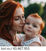 A mother lovingly gazes at her infant baby, holding the child close in her arms. Cute infant child is calm. Love of mother and child. Happy childhood. Family relationships, motherhood and fertility. Стоковое AI-изображение, AI-художник Юлия Петровская / Фотобанк Лори