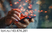 A person is holding a phone with "like", "message", "comment" and "like" notification icons floating above the smartphone screen, as well as with social networks and digital communications. Стоковое AI-видео, аниматор Терехова Марина / Фотобанк Лори