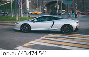 Luxurious super car McLaren GT on city street. Редакционное фото, фотограф Константин Григорьев / Фотобанк Лори
