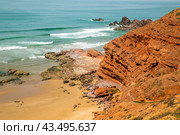 Picturesque red cliffs on shores of the Atlantic Ocean. Morocco (2024 год). Стоковое фото, фотограф Евгений Ткачёв / Фотобанк Лори