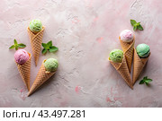 Sweet dessert. Ice cream cones with different flavors on a concrete pink background. World Ice Cream Day. Стоковое AI-изображение, AI-художник Photojuli / Фотобанк Лори
