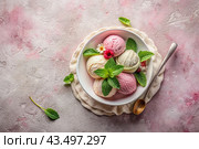Sweet dessert. Ice cream balls with different flavors on a concrete pink background. World Ice Cream Day. Стоковое AI-изображение, AI-художник Photojuli / Фотобанк Лори