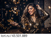 A party. A beautiful, happy girl in a stylish festive dress surrounded by gold confetti and sequins. The concept of celebrating a birthday and a happy new year. Close-up. Стоковое AI-изображение, AI-художник Photojuli / Фотобанк Лори