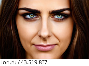 Portrait of a woman with dark skin, looking at the camera with an emotion of dissatisfaction, close-up. Стоковое AI-изображение, AI-художник Коханова Наталья / Фотобанк Лори